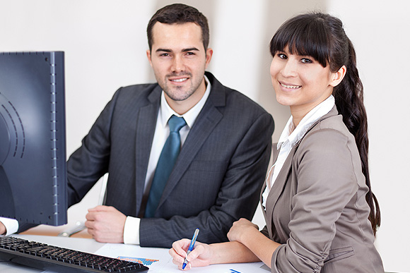 two business people smiling
