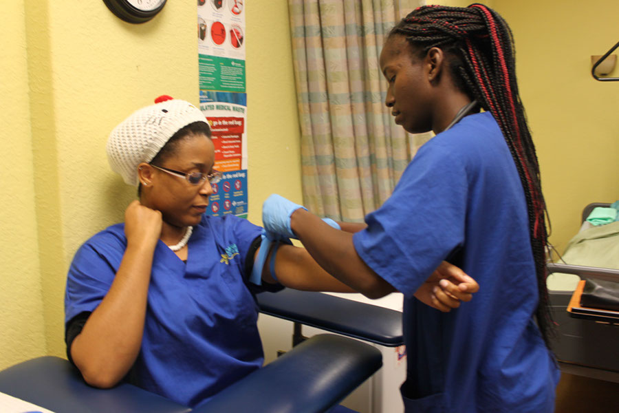 Daytona College nursing students learning to take blood pressure
