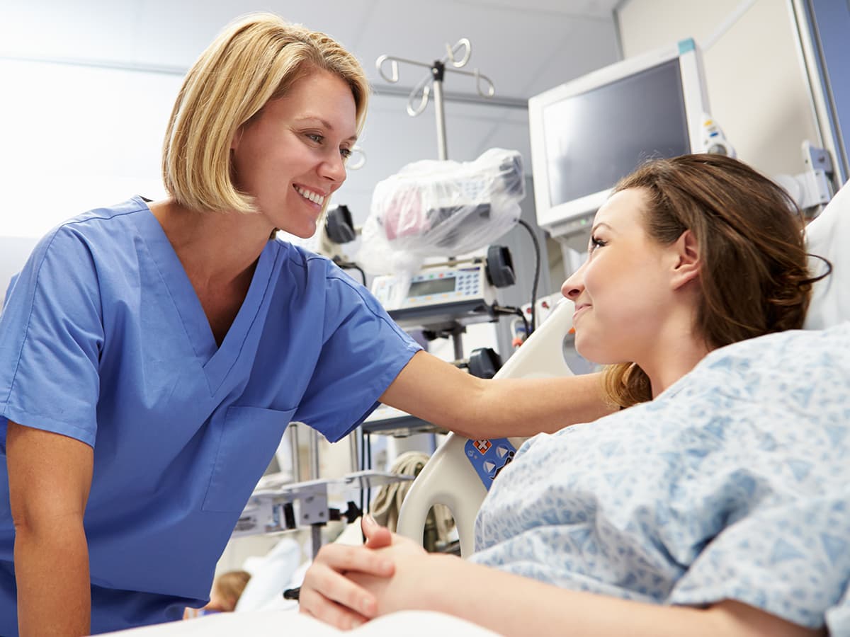 nurse and patient smiling and talking