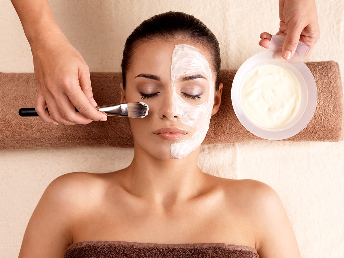 woman getting a facial at a spa