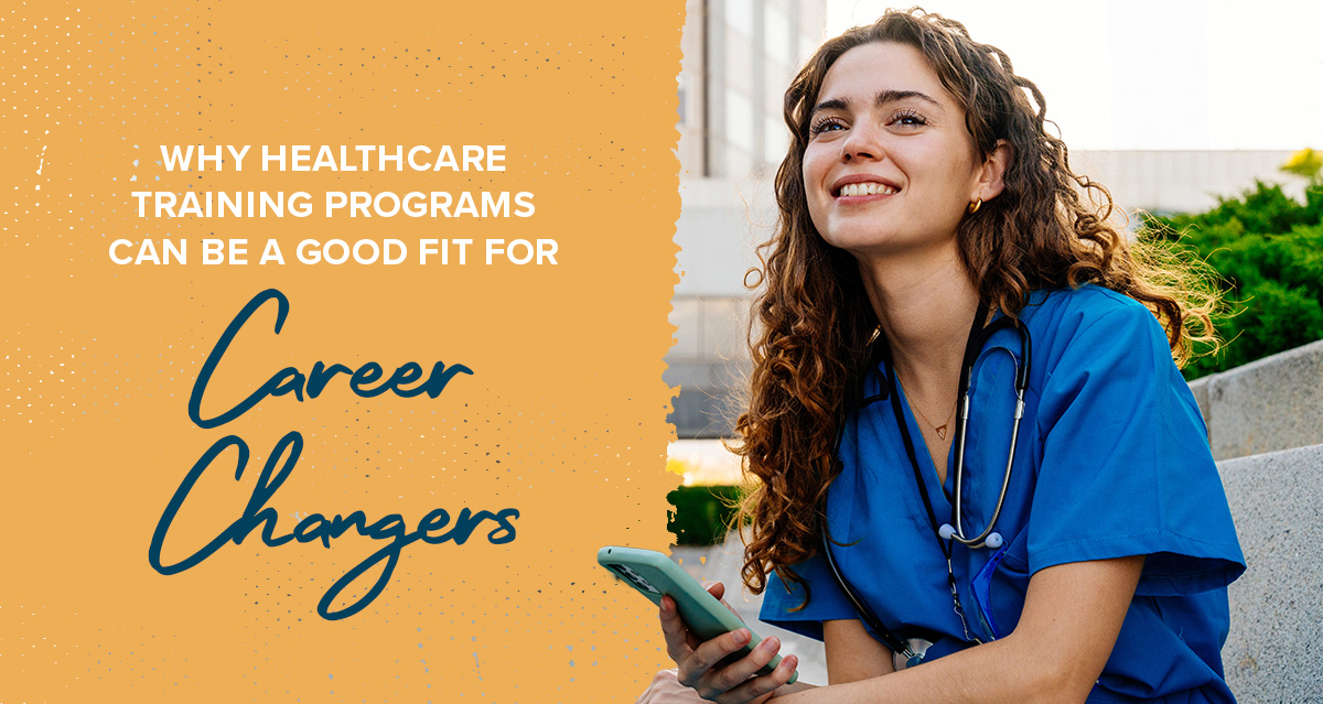 woman in healthcare scrubs looking away from her phone