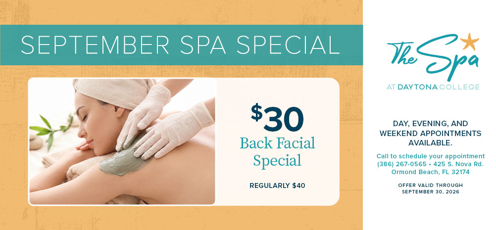 woman receiving a back massage/facial
